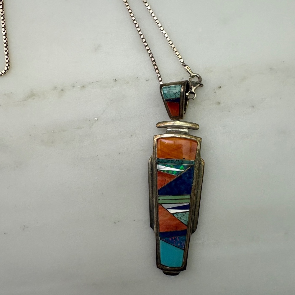 Sterling, coral, turquoise, lapis pendant on a sterling chain.